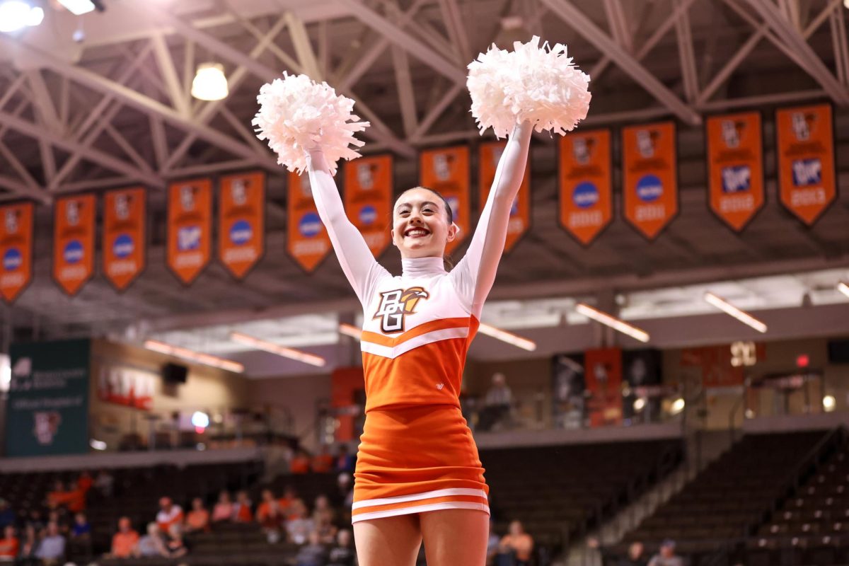 Bowling Green, OH - Freshman cheerleader Grace Kelley cheers at the Stroh Center in Bowling Green, Ohio.