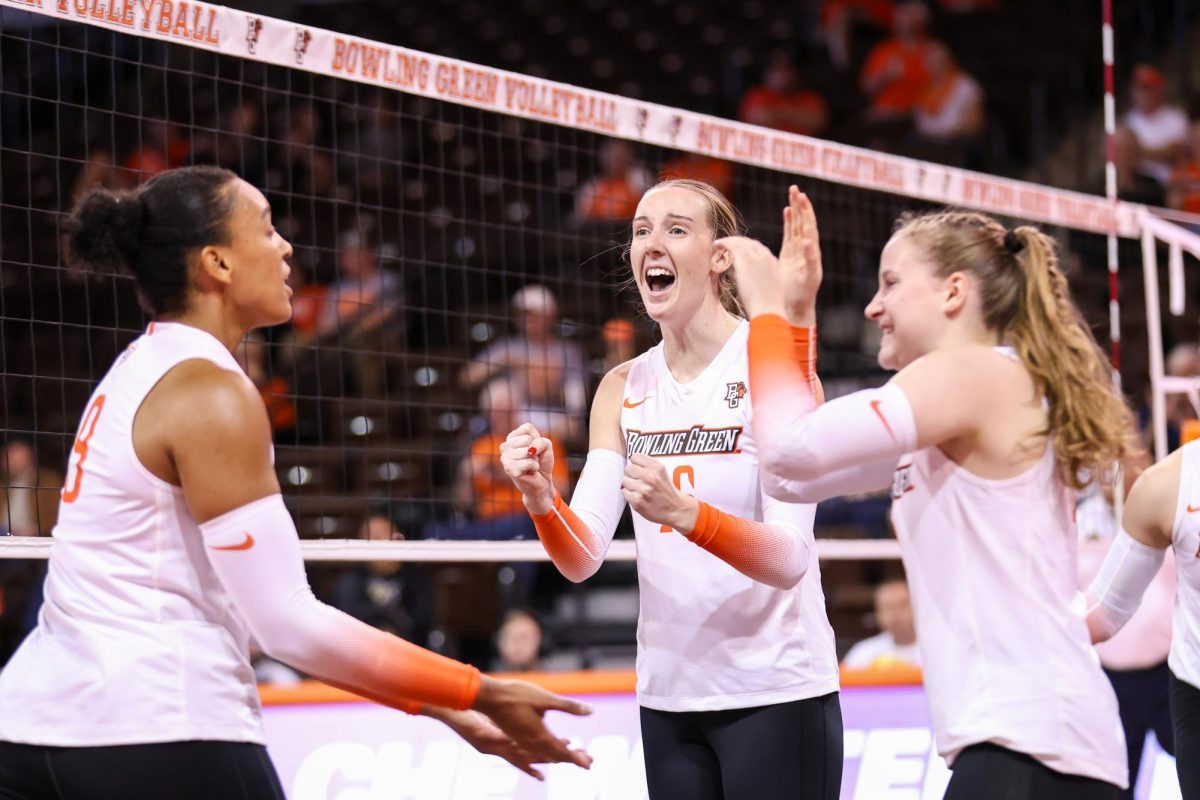 Bowling Green, OH - Falcons Fifth year middle blocker Alexis Mettille (16) celebrates after scoring against Western Michigan at the Stroh Center in Bowling Green, Ohio.