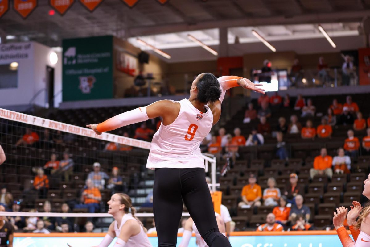 Bowling Green, OH - Falcons Senior outside hitter Mia Tyler (9) prepares to send the ball back to the Western Michigan Broncos at the Stroh Center in Bowling Green, Ohio.