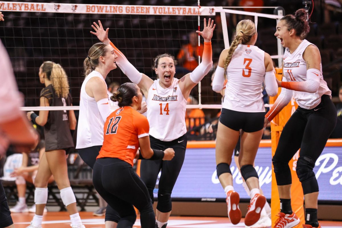 Bowling Green, OH - Multiple Falcons celebrate scoring a crucial point against Western Michigan at the Stroh Center in Bowling Green, Ohio.