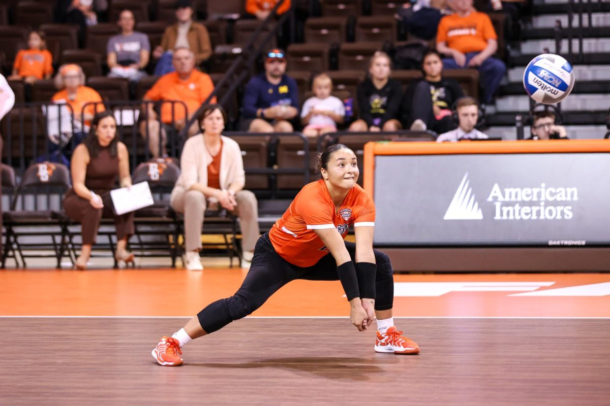 Bowling Green, OH - Falcons Graduate student libero Lindsey LaPinta (12) extends to hit the ball against Western Michigan at the Stroh Center in Bowling Green, Ohio.

