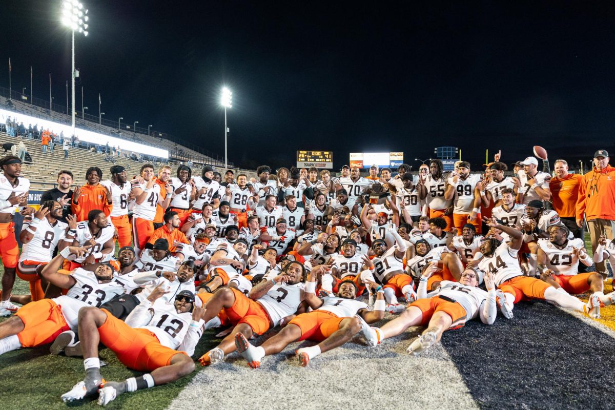 Toledo, OH - The Falcon football team poses after winning the Battle of I-75 against the Rockets at the Glass Bowl in Toledo, Ohio.