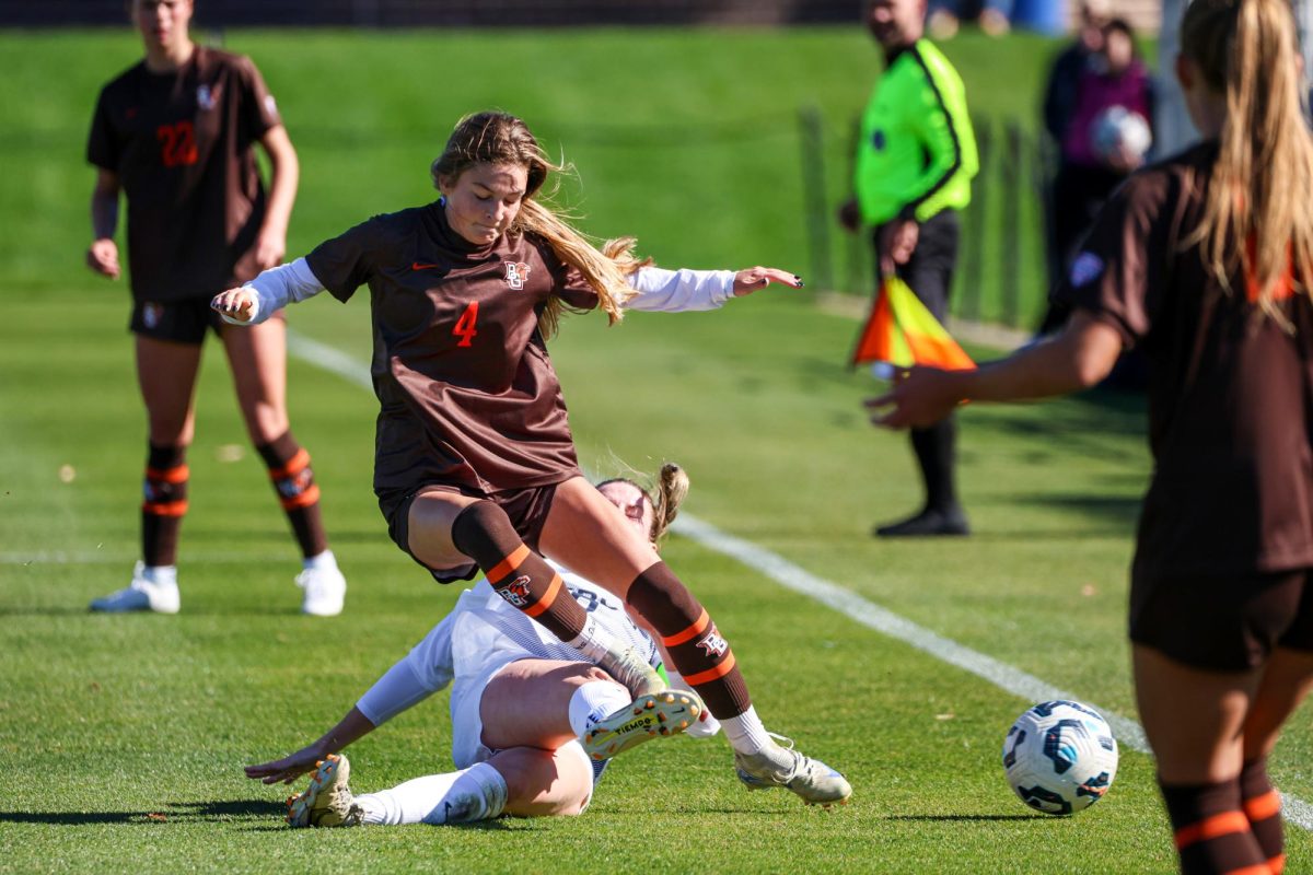 Akron, OH – Falcons sophomore midfielder Emme Butera (4) passes the ball prior to be taken down by an Akron Zip at FirstEnergy Stadium in Akron, Ohio.