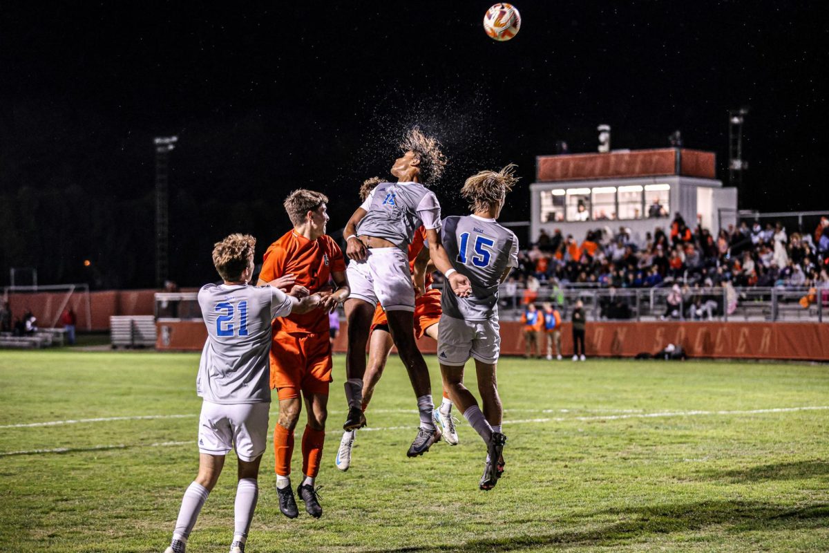 Bowling Green, OH - A group of Drake Bulldogs and Bowling Green Falcons go up for the ball late in a contest at Cochrane Stadium in Bowling Green, Ohio.