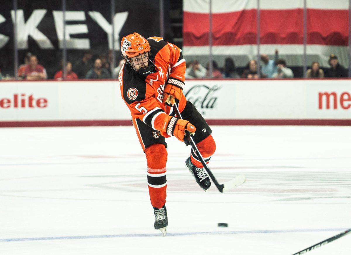 Columbus, OH – Falcons sophomore defender Gustav Stjernberg (5) shoots the puck at The Schottenstein Center in Columbus, Ohio.