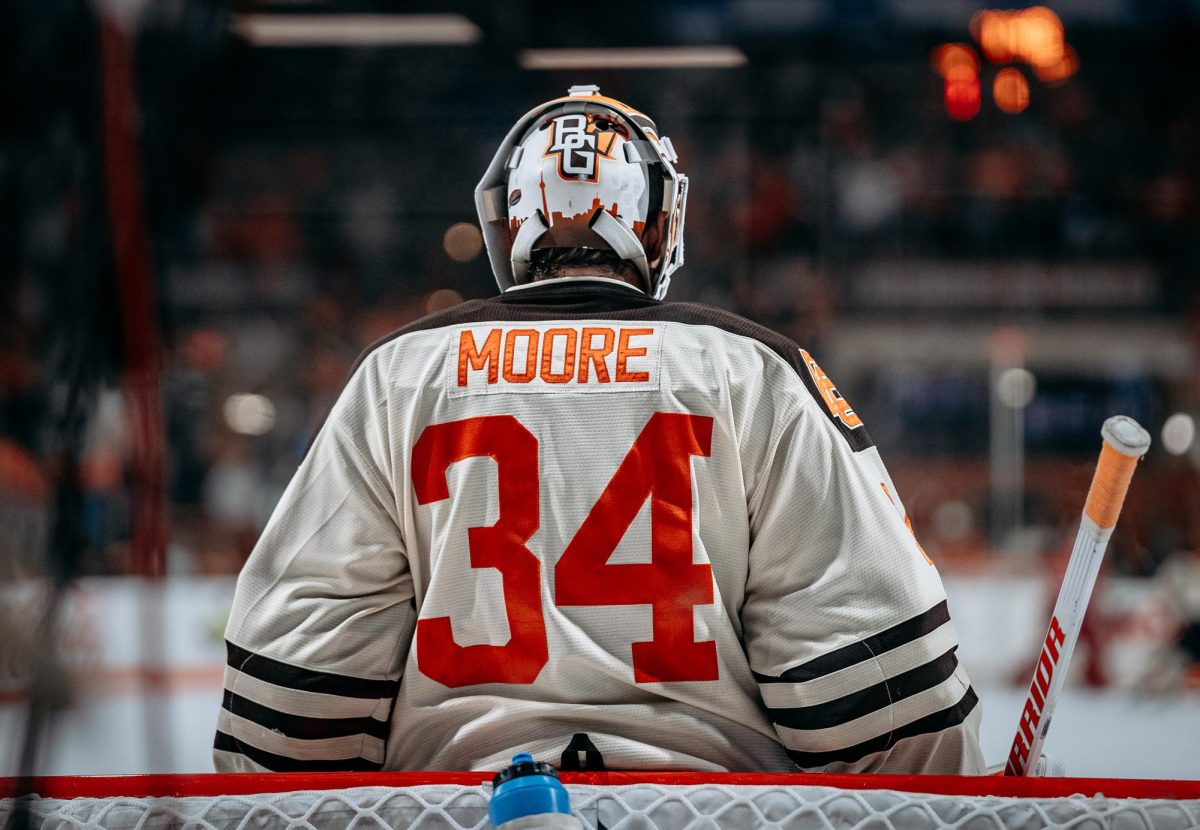 Bowling Green, OH – Falcons sophomore goaltender Cole Moore (34) sitting in goal at Slater Family Ice Arena in Bowling Green, Ohio.