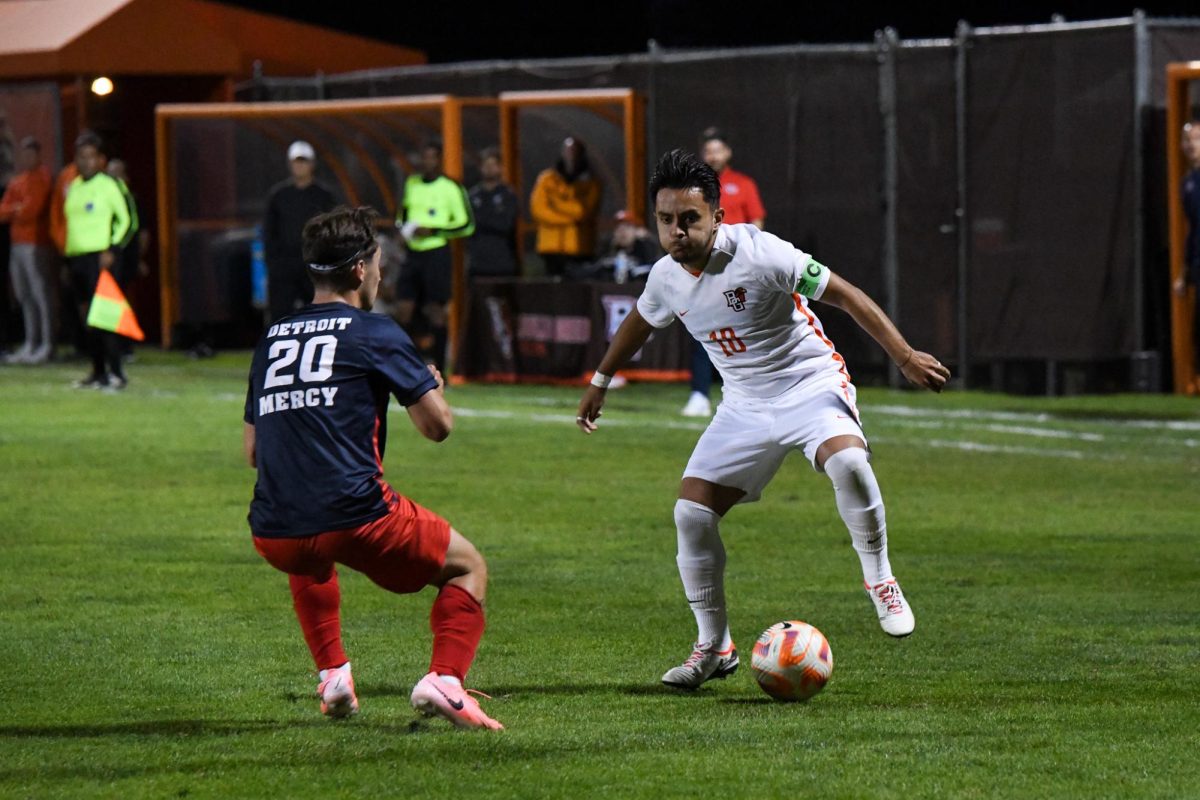 Bowling Green, OH - Falcons senior midfielder Albert Anaya (10) fighting through the Titans defense at Cochrane Stadium in Bowling Green, Ohio.