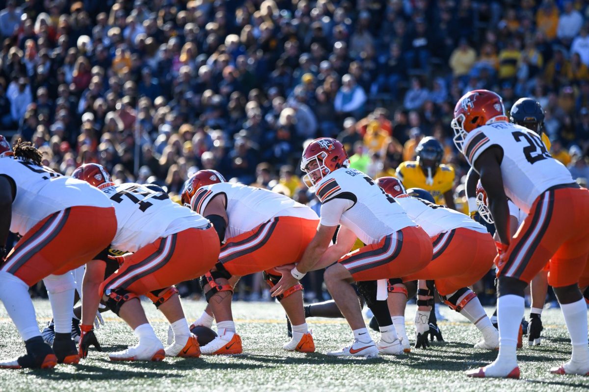 Toledo, OH - Falcons senior quarterback Connor Bazelak (7) receiving the snap at the Glass Bowl in Toledo, Ohio.