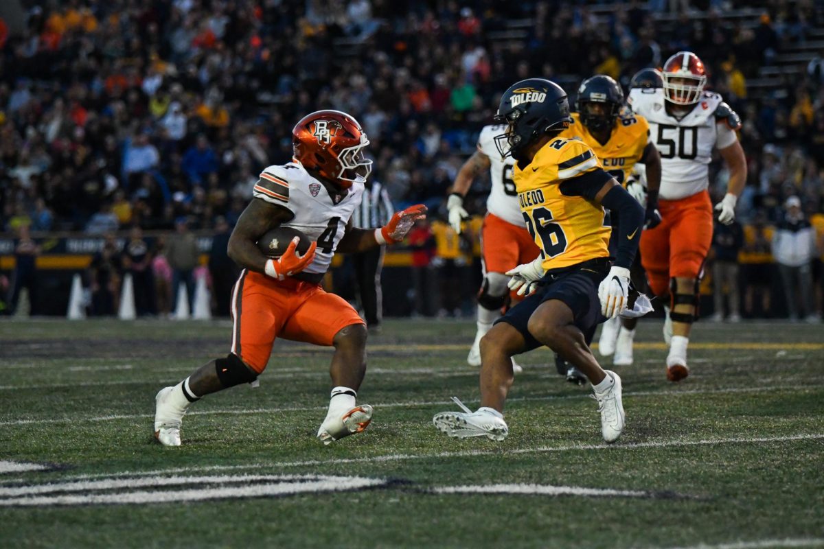 Toledo, OH - Falcons junior running back Terion Stewart (4) charging  through the Rockets defense at the Glass Bowl in Toledo, Ohio.