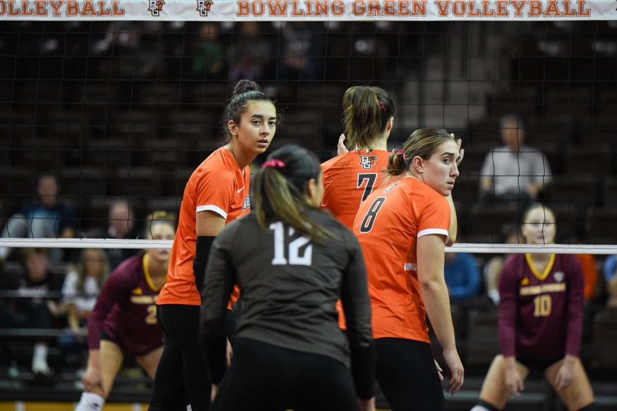 Bowling Green, OH - Falcons sophomore setter Amanda Otten (11) and fifth year outside hitter Jordan Newblatt (8) awaiting the serve at Stroh Center in Bowling Green, Ohio.