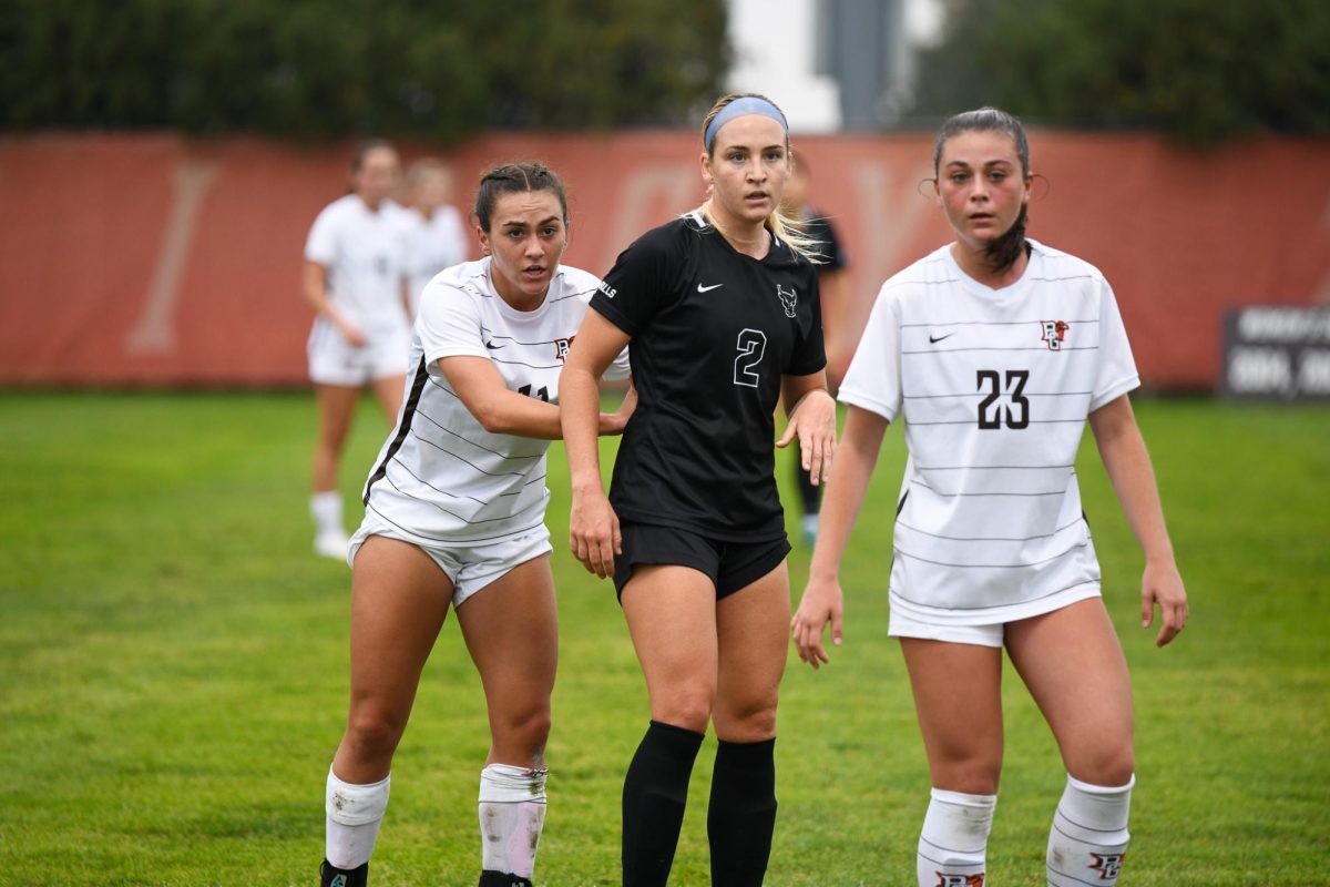 Bowling Green, OH - Falcons senior midfielder Jaden Frigerio (11) and freshman midfielder Lauren Mahoney (23) locking down a Bulldog before a free kick at Cochrane Stadium in Bowling Green, Ohio.