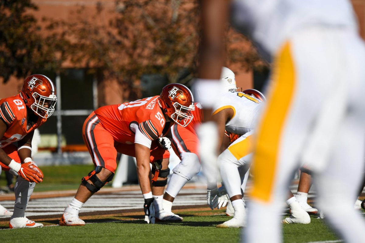 Bowling Green, OH - Falcons senior outside tackle Alex Wollschlaeger (50) fighting through the Golden Flashes offensive line at Doyt L. Perry Stadium in Bowling Green, Ohio.