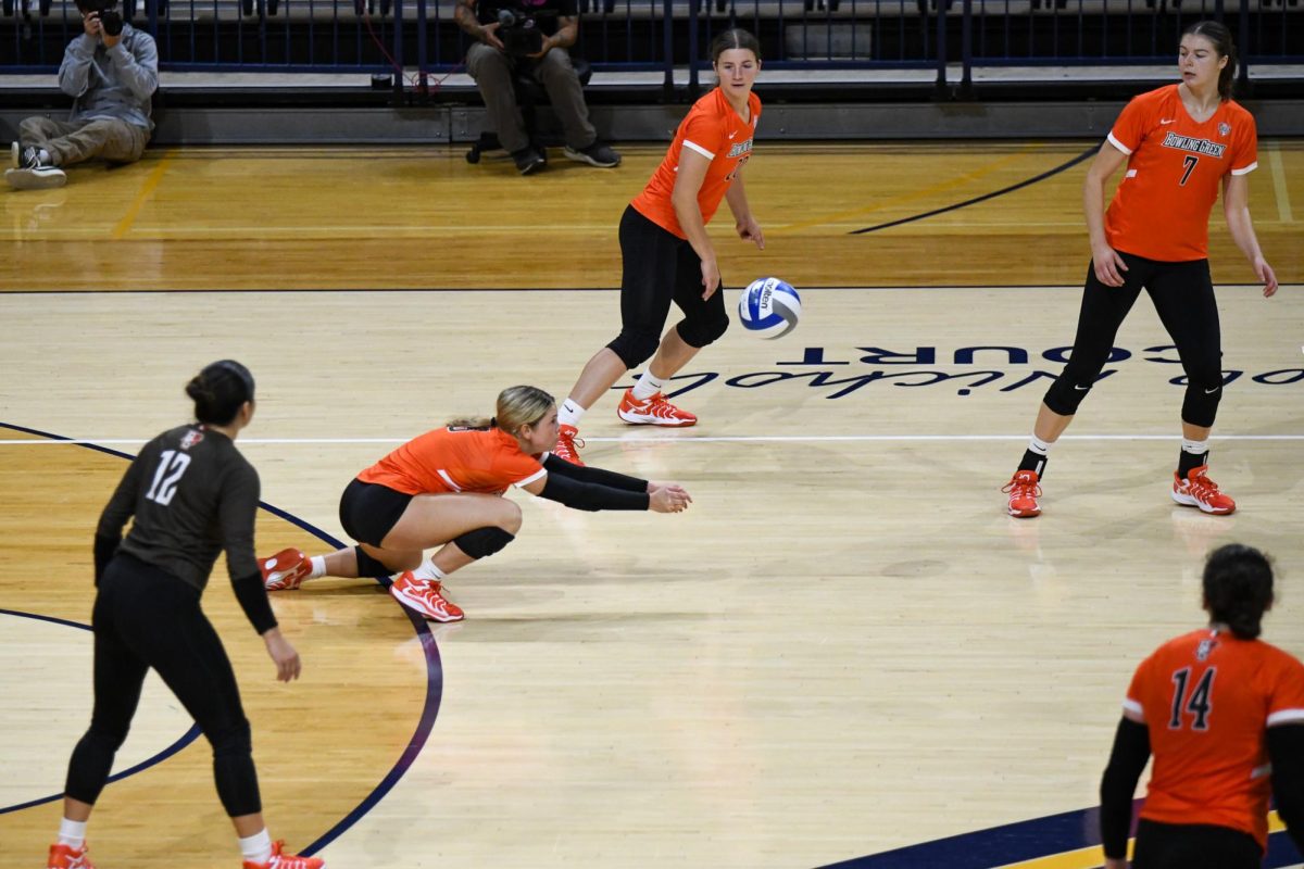 Toledo, OH - Falcons freshman defensive specialist Avery Anders (3) narrowly saving a ball from hitting the ground at Savage Arena in Toledo, Ohio.