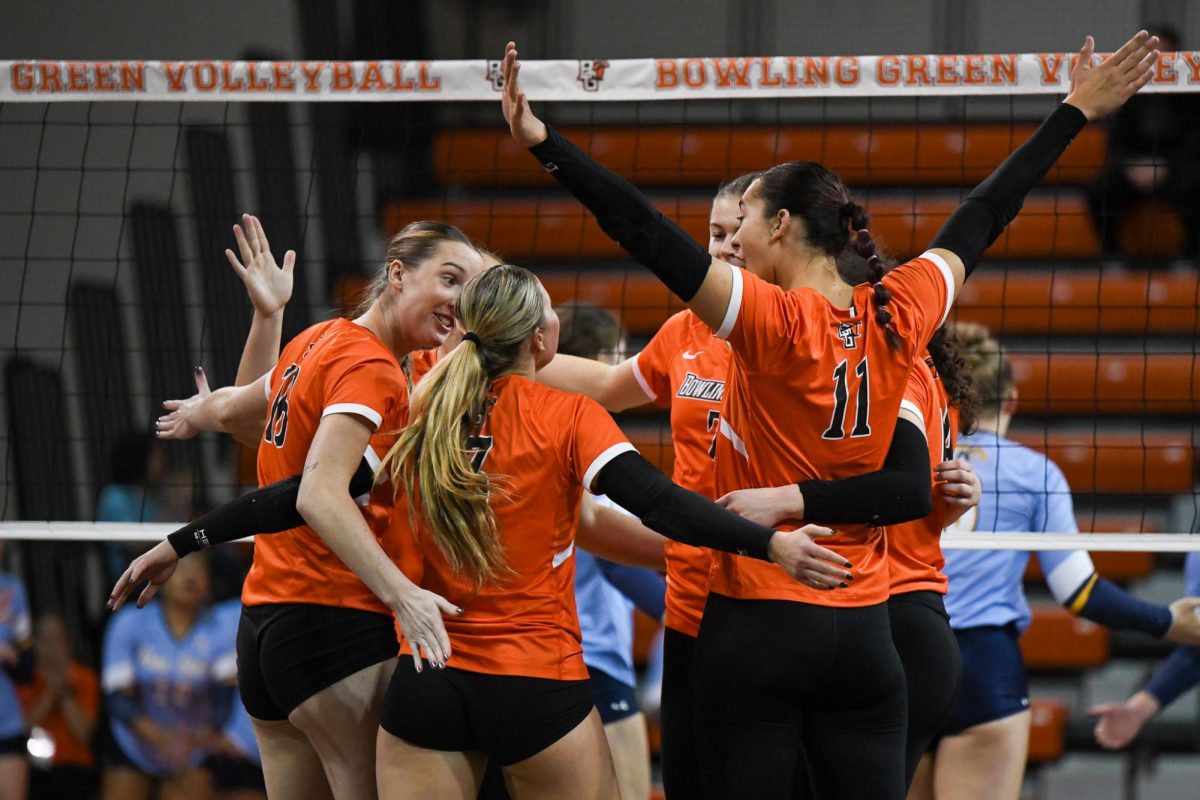 Bowling Green, OH - Falcons celebrating taking the first set from Golden Flashes at Stroh Center in Bowling Green, Ohio.