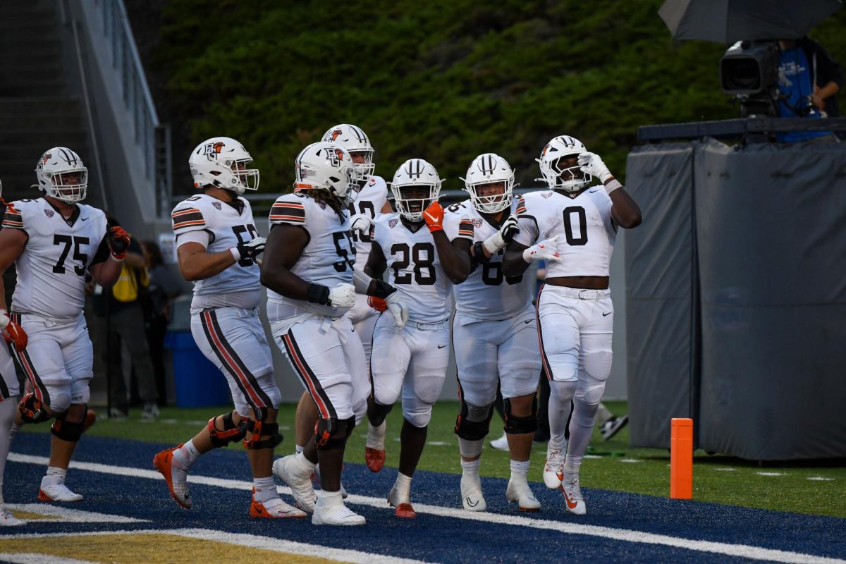 Akron, OH - Falcons junior tight end Harold Fannin Jr. (0) celebrates his touchdown late in the game with the team at InfoCision Stadium in Akron, Ohio.