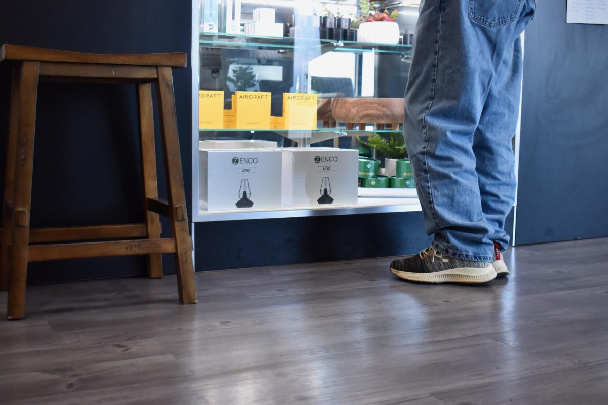 A dispensary patron looking at the options for purchase