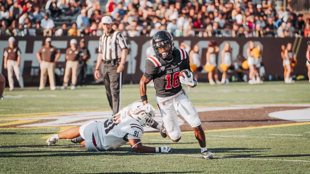 Ball State's AJ Taylor runs the ball down the field. 