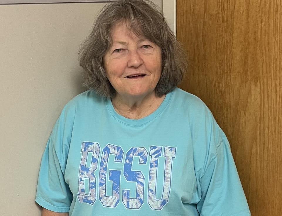 Nancy Spencer, P.h.D standing outside of the Maxwell Media Watch meeting room