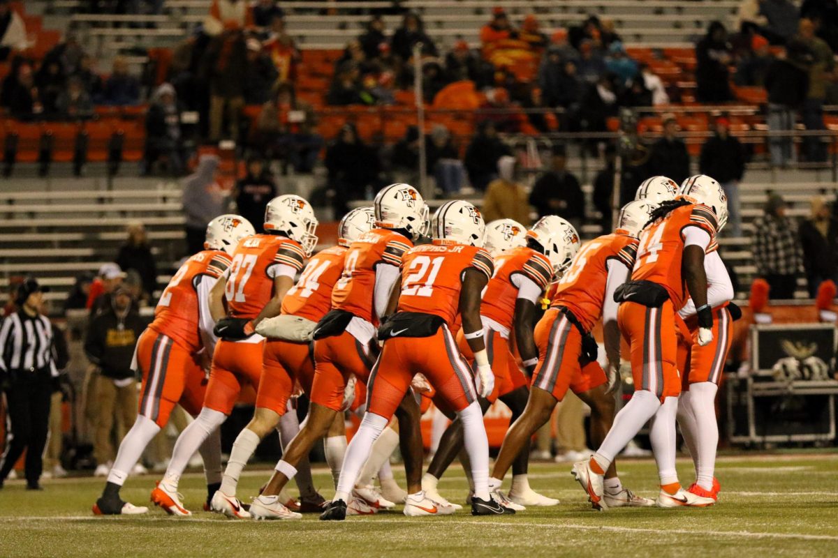 Bowling Green, OH - Falcons huddle while preparing to kickoff the ball to the Broncos at Doyt L. Perry Stadium in Bowling Green, Ohio.