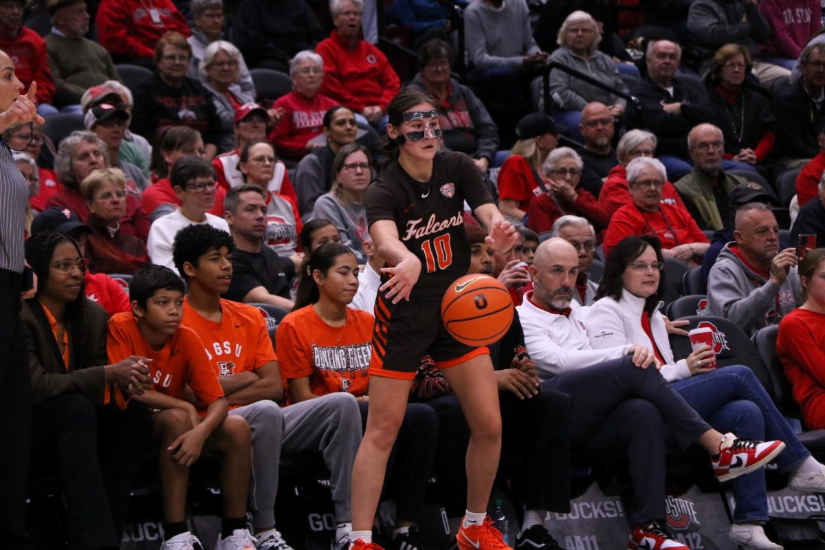 Columbus, OH - Falcons sophomore guard Paige Kohler (10) makes a pass towards the basket for an assist at Schottenstein Center in Columbus, Ohio.