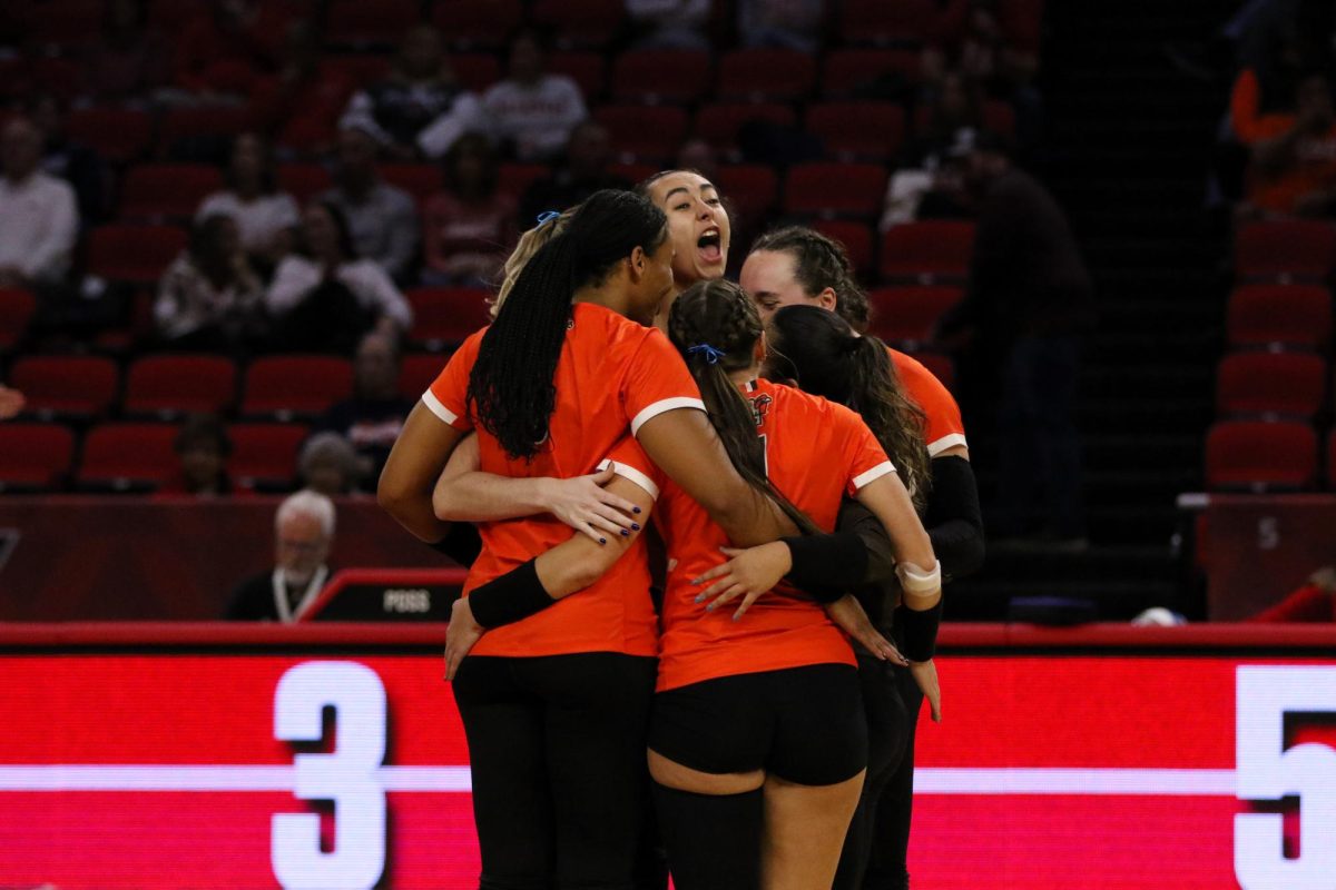 Oxford, OH - Falcons celebrate after scoring another point in a close final set with the RedHawks at Millett Stadium in Oxford, Ohio.