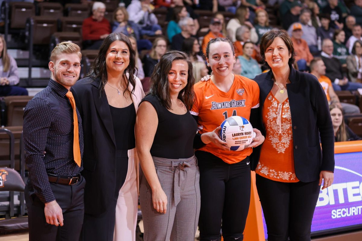 Bowling Green, OH - Falcons junior opposite Lauryn Hovey (14) being recognized prior to the game for achieving 1,000 career kills as a Falcon at the Stroh Center in Bowling Green, Ohio.