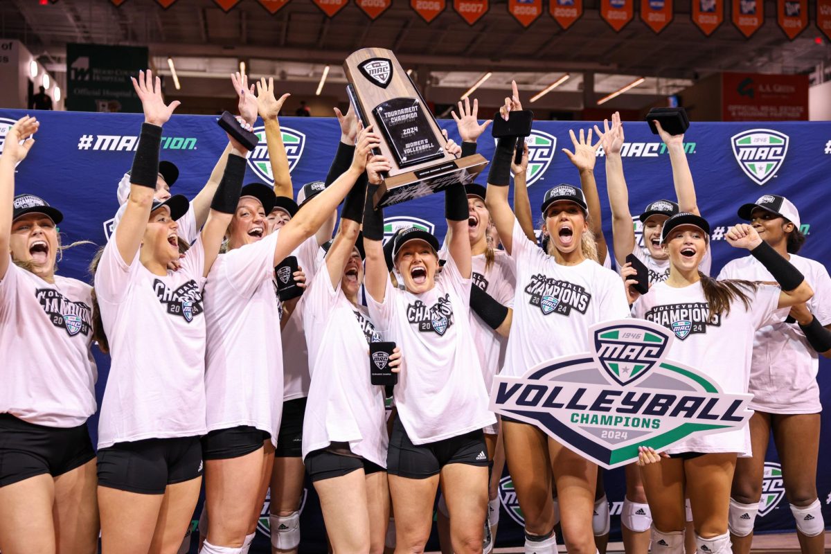 Bowling Green, OH - The Western Michigan Broncos celebrate winning the MAC Tournament at the Stroh Center in Bowling Green, Ohio.