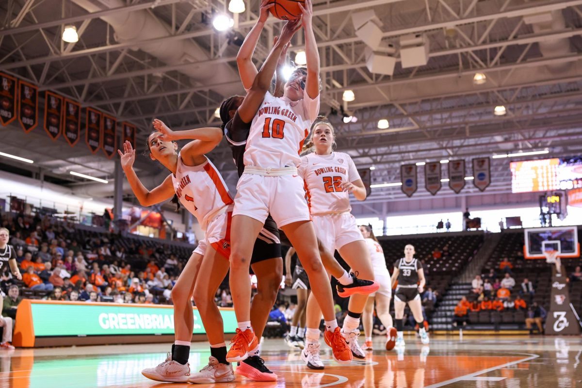 Bowling Green, OH - Falcons sophomore guard Paige Kohler (10) fights a Bonnie for the rebound at the Stroh Center in Bowling Green, Ohio.