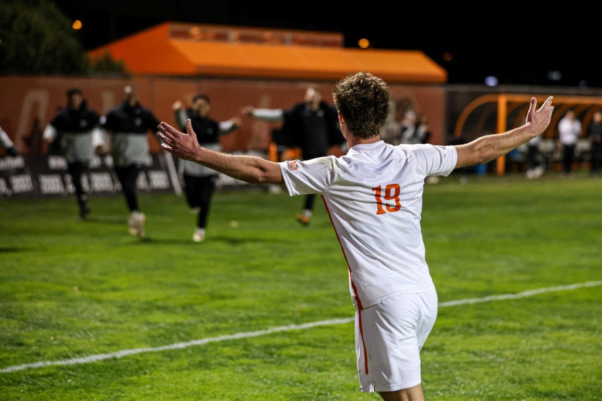 Bowling Green, OH - Freshman midfielder Ryko Bodurov (19) runs towards the bench after scoring a goal in the MVC quarterfinal round against the Flames at Cochrane Stadium in Bowling Green, Ohio.