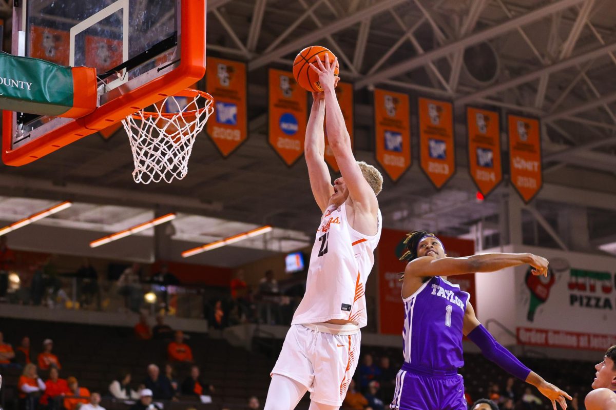 Bowling Green, OH - Falcons junior forward Youssef Khayat (23) goes up for the dunk against the Taylor Trojans at the Stroh Center in Bowling Green, Ohio.