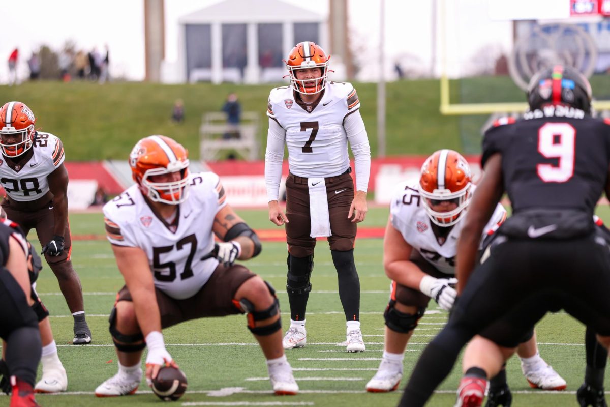 Muncie, IN - Falcons senior quarterback Connor Bazelak (7) makes an adjustment prior to the snap against the Cardinals at Scheumann Stadium in Muncie, Indiana.