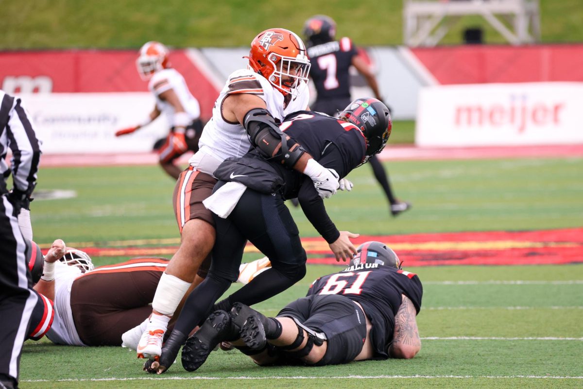 Muncie, IN - Falcons senior defensive lineman Ali Saad (99) forces a fumble in a victory over the Ball State Cardinals at Scheumann Stadium in Muncie, Indiana.