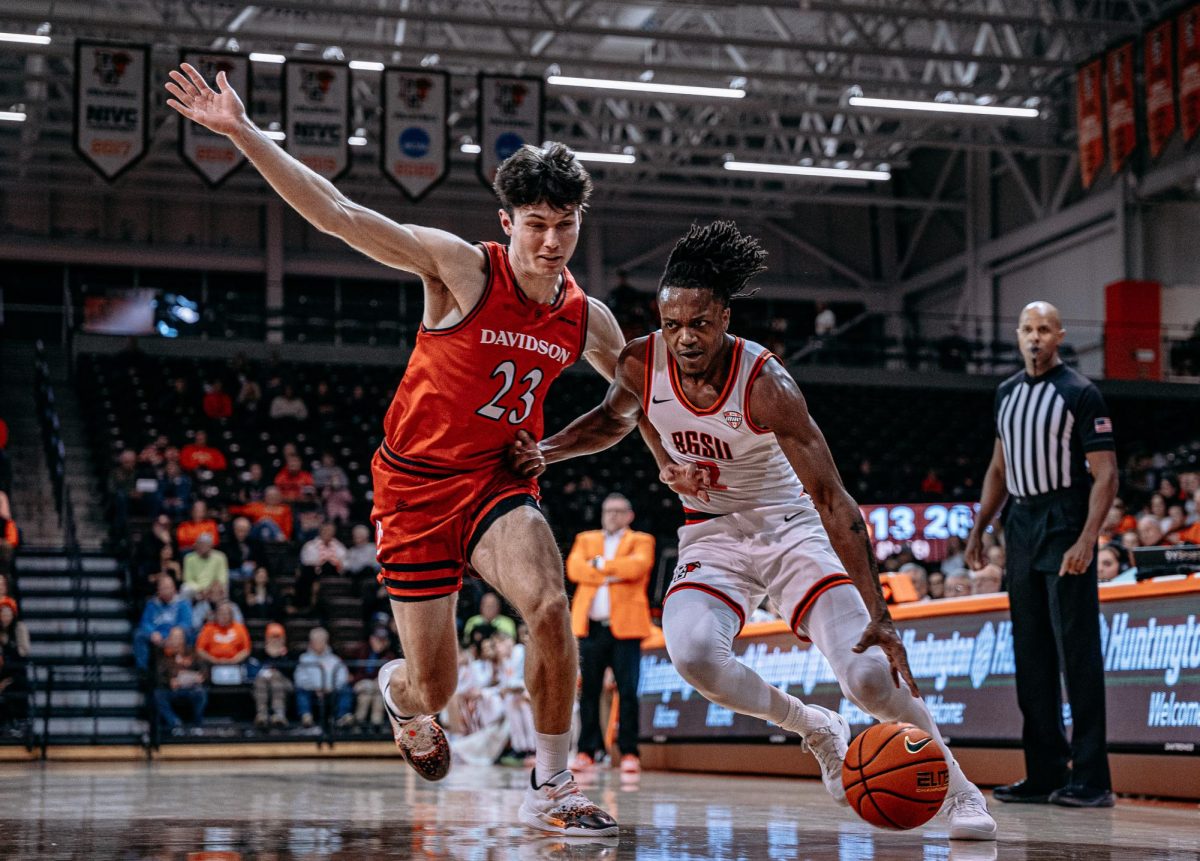 Bowling Green, OH – Falcons junior guard Javontae Campbell (2) takes on a Wildcat defender at the Stroh Center in Bowling Green, Ohio