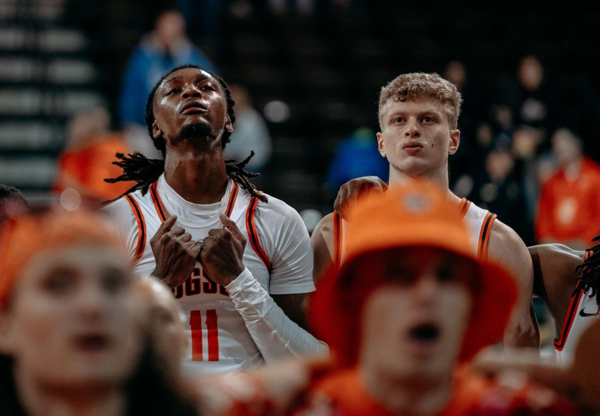 Bowling Green, OH – Falcons redshirt freshman Jamai Felt (11) and Junior Youssef Khayat (23) standing in low spirits during the alma mater at the Stroh Center in Bowling Green, Ohio