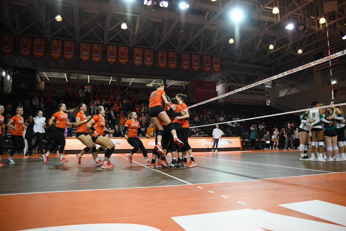 Bowling Green, OH - Falcons celebrating after taking the win against the Bobcats at the Stroh Center in Bowling Green, Ohio.