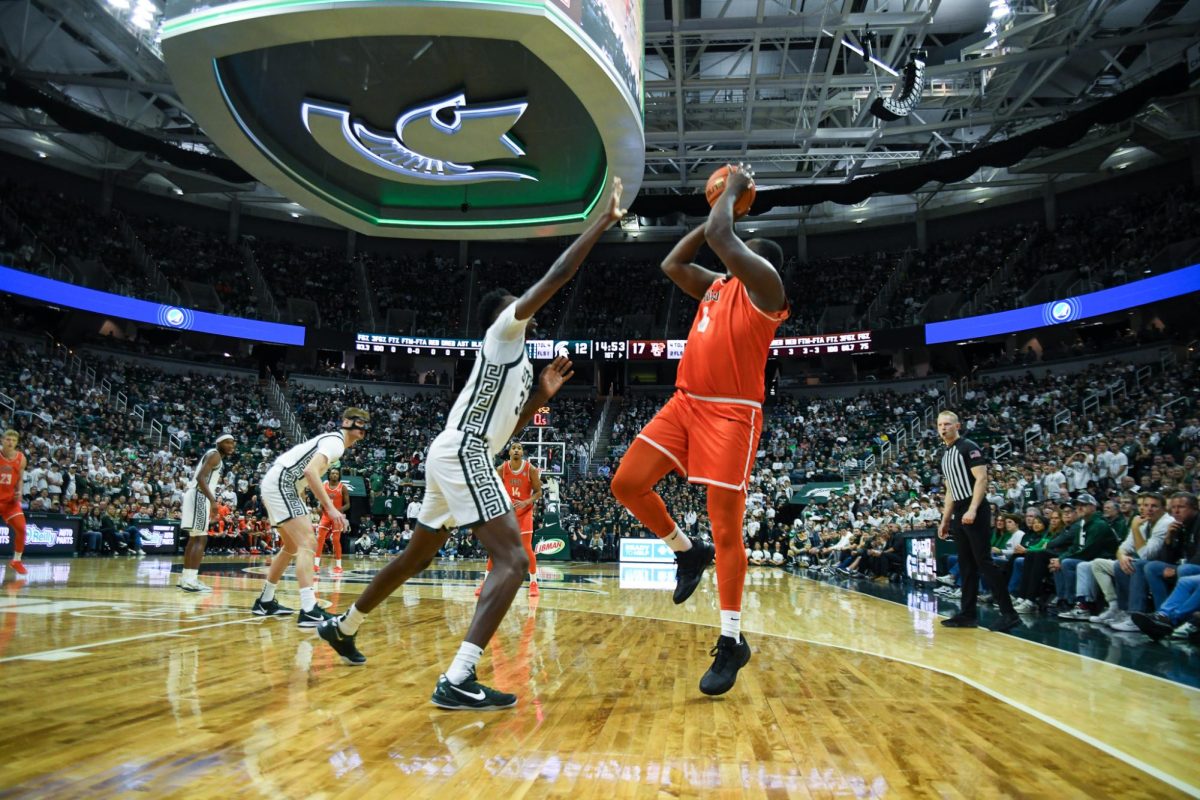 Lansing, MI - Falcons senior forward (6) taking a step back shot over the Spartans at Breslin Center in Lansing, Michigan.