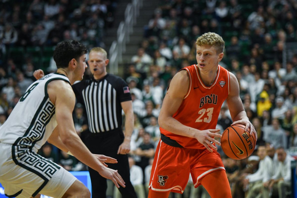 Lansing, MI - Falcons junior forward Yousef Kayat (23) looking for a play to develop at Breslin Center in Lansing, Michigan.