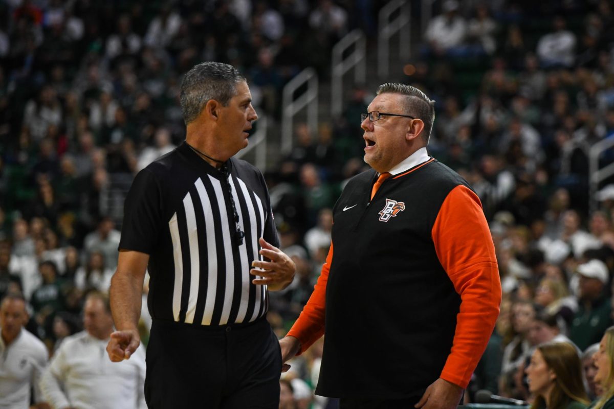 Lansing, MI - Falcons head coach Todd Simon discussing a call with the ref at Breslin Center in Lansing, Michigan.