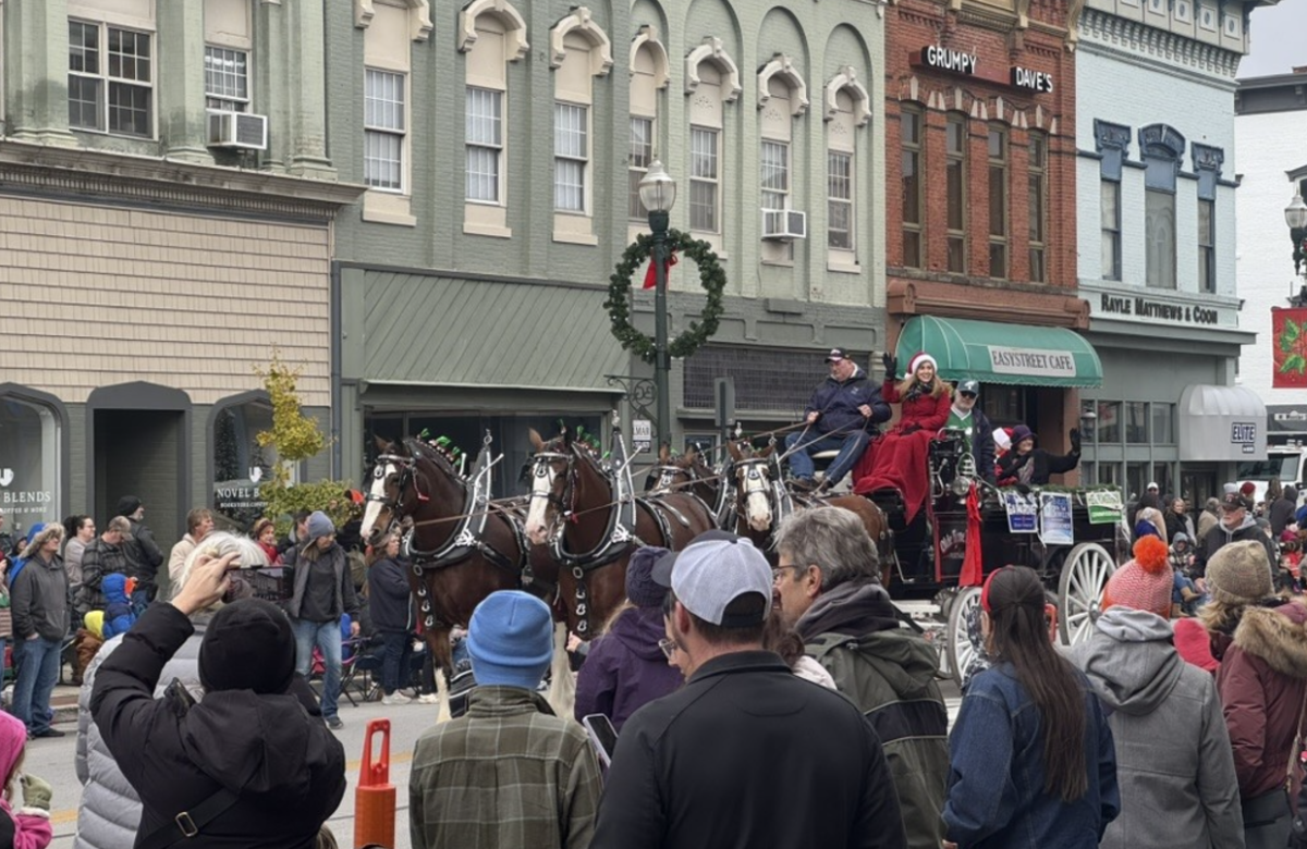 Holiday parade attendants see Mrs. Claus in one of the parade's floats