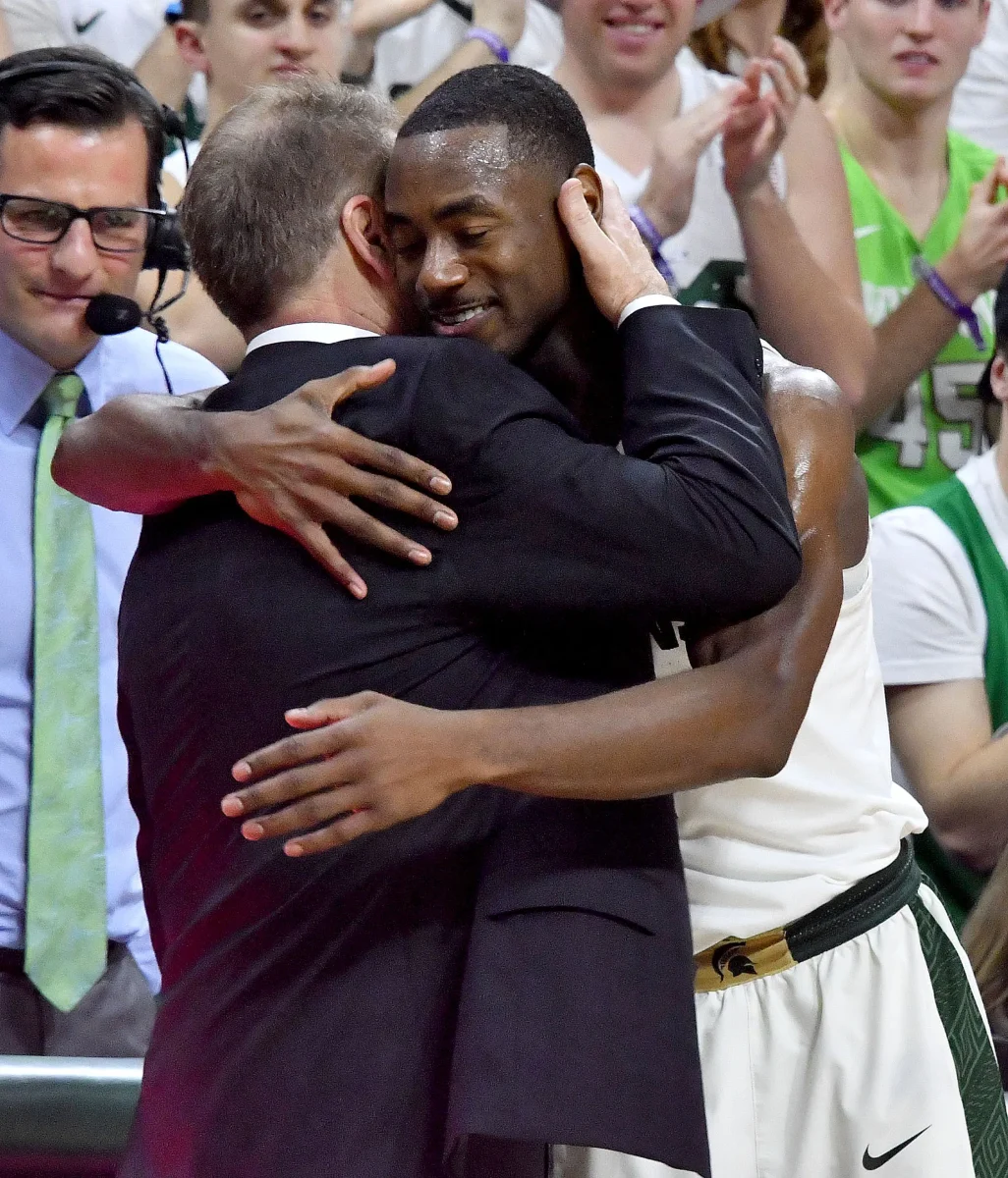 Lourawls "Tum Tum" Nairn hugs Michigan State head coach Tom Izzo as he leaves the home court for the final time on Feb. 20, 2018.