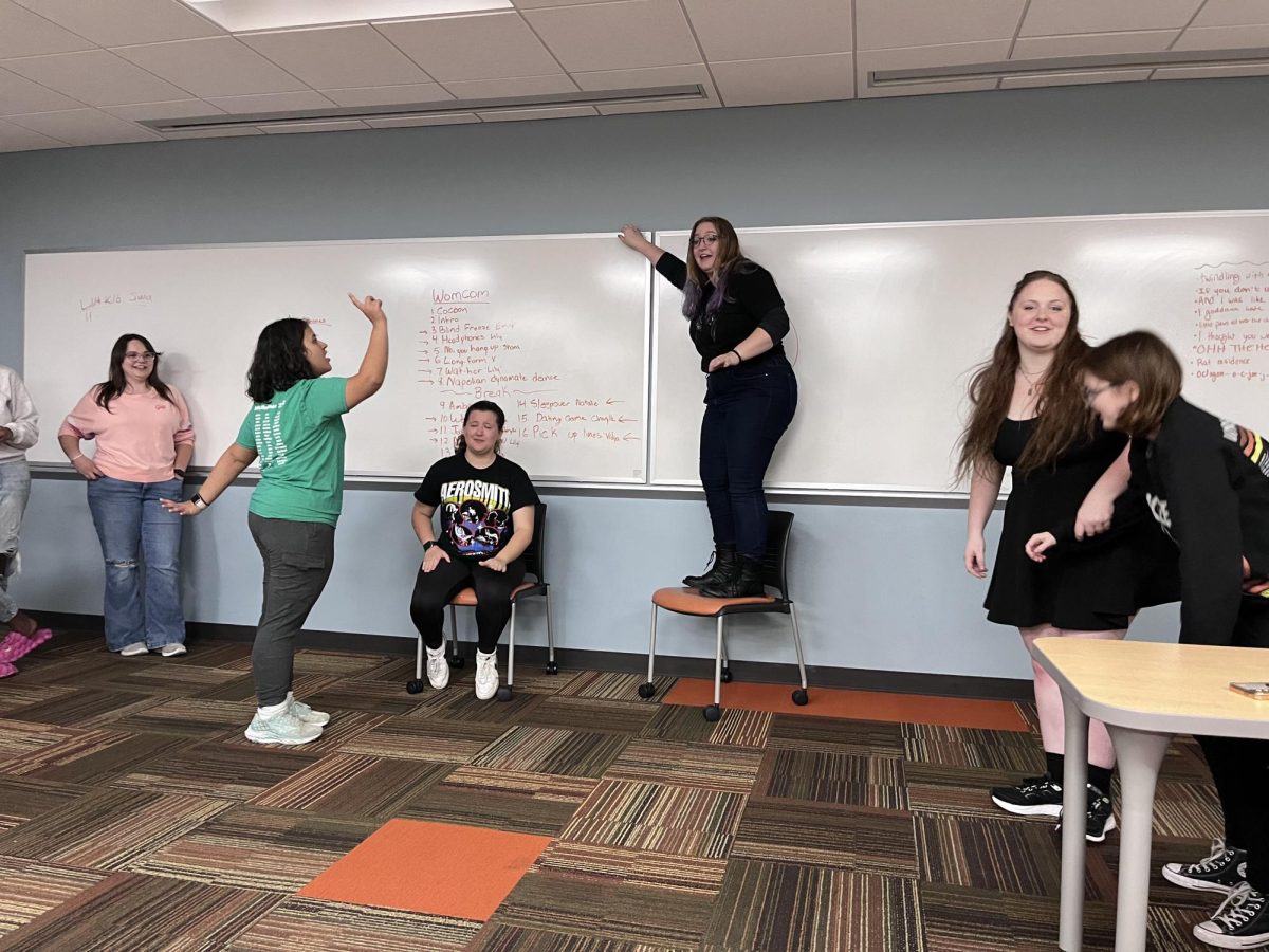 Lady Parts rehearsing for their upcoming WOMCOM performance