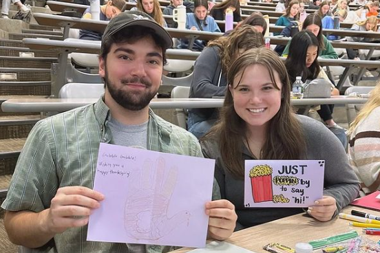 Students with their letters of love via the Letters of Love @ BGSU Instagram page