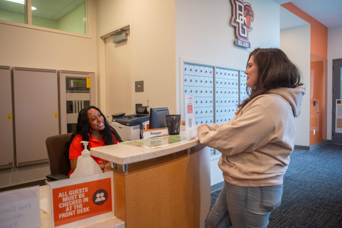 A Centennial RA sitting at front desk via Bowling Green State University