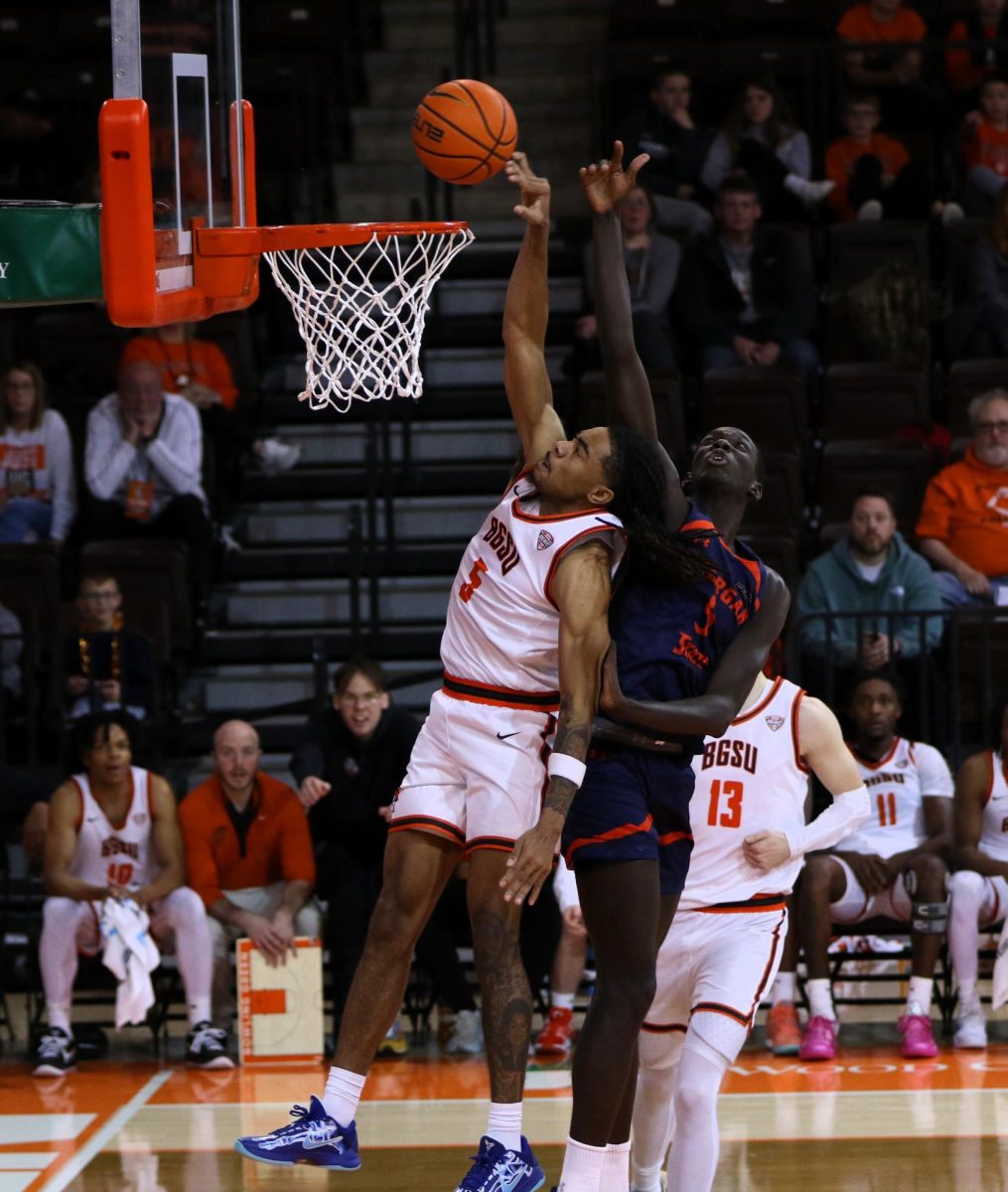 Bowling Green, OH - Falcons sophomore guard Braelon Green (5) goes up and gets fouled on a dunk by Morgan State at the Stroh Center in Bowling Green, Ohio.