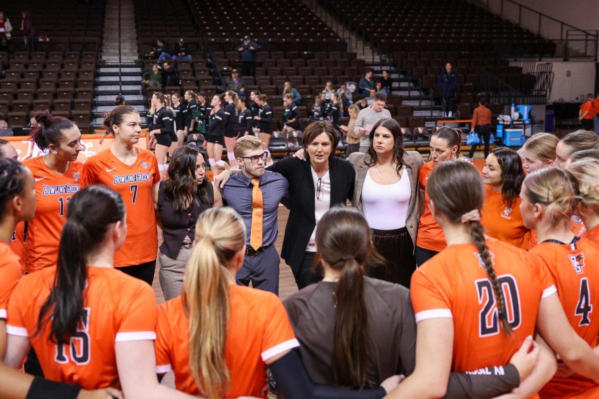 Bowling Green, OH - The Falcons volleyball team forms a circle and listens to head coach Danijela Tomic after defeating the Binghamton Bearcats, three sets to one, at the Stroh Center in Bowling Green, Ohio.