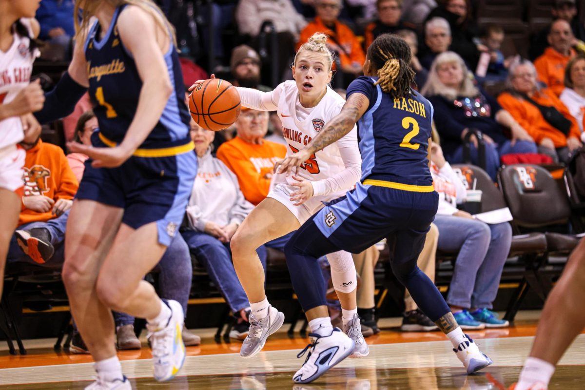 Bowling Green, OH - Falcons fifth year guard Lexi Fleming (25) battles a Golden Eagle at the Stroh Center in Bowling Green, Ohio.