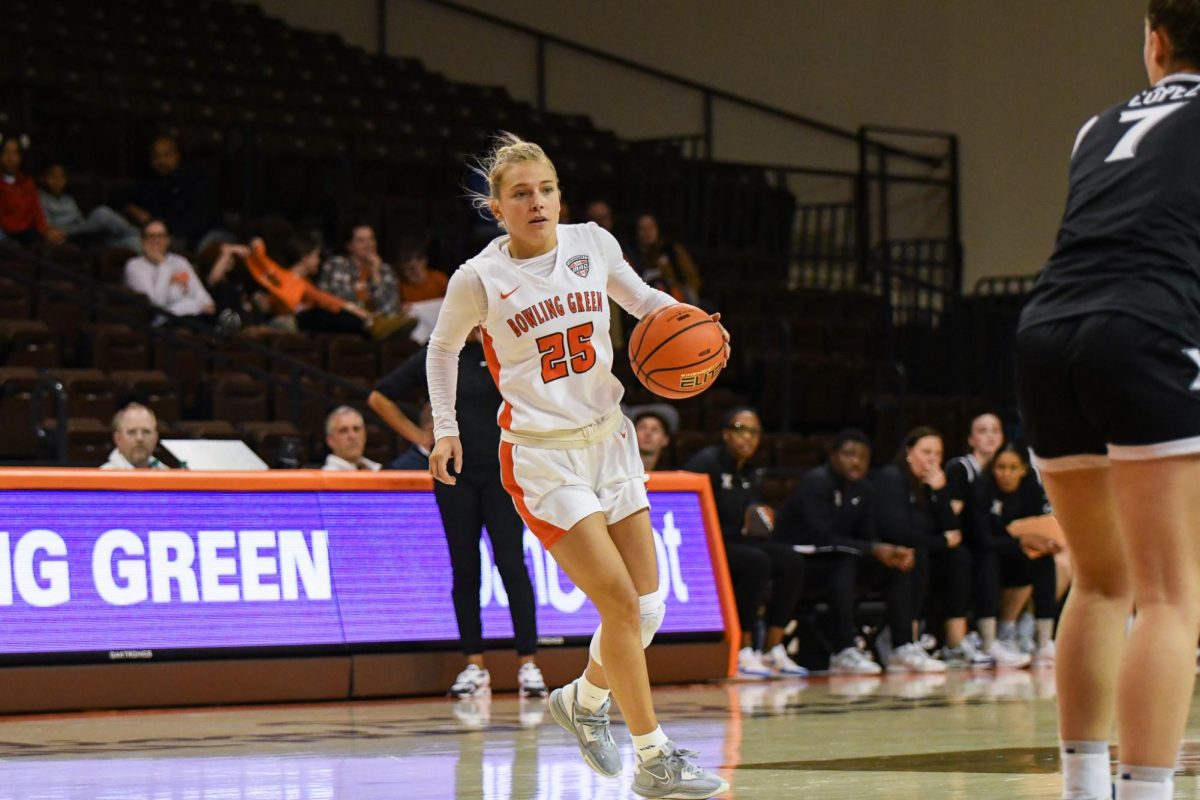 Bowling Green, OH - Falcons fifth year guard (25) looking for an opening on  the perimeter at the Stroh Center in Bowling Green, Ohio.