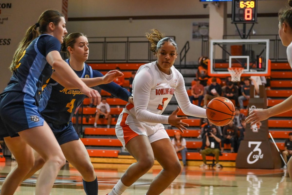 Bowling Green, OH - Falcons freshman guard Johnea Donahue (3) begins to pick up the ball for a pass at the Stroh Center in Bowling Green, Ohio.