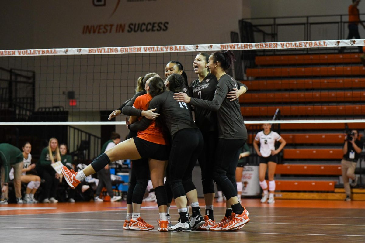 Bowling Green, OH - Falcons celebrating after taking the third set from the Raiders at the Stroh Center in Bowling Green, Ohio.