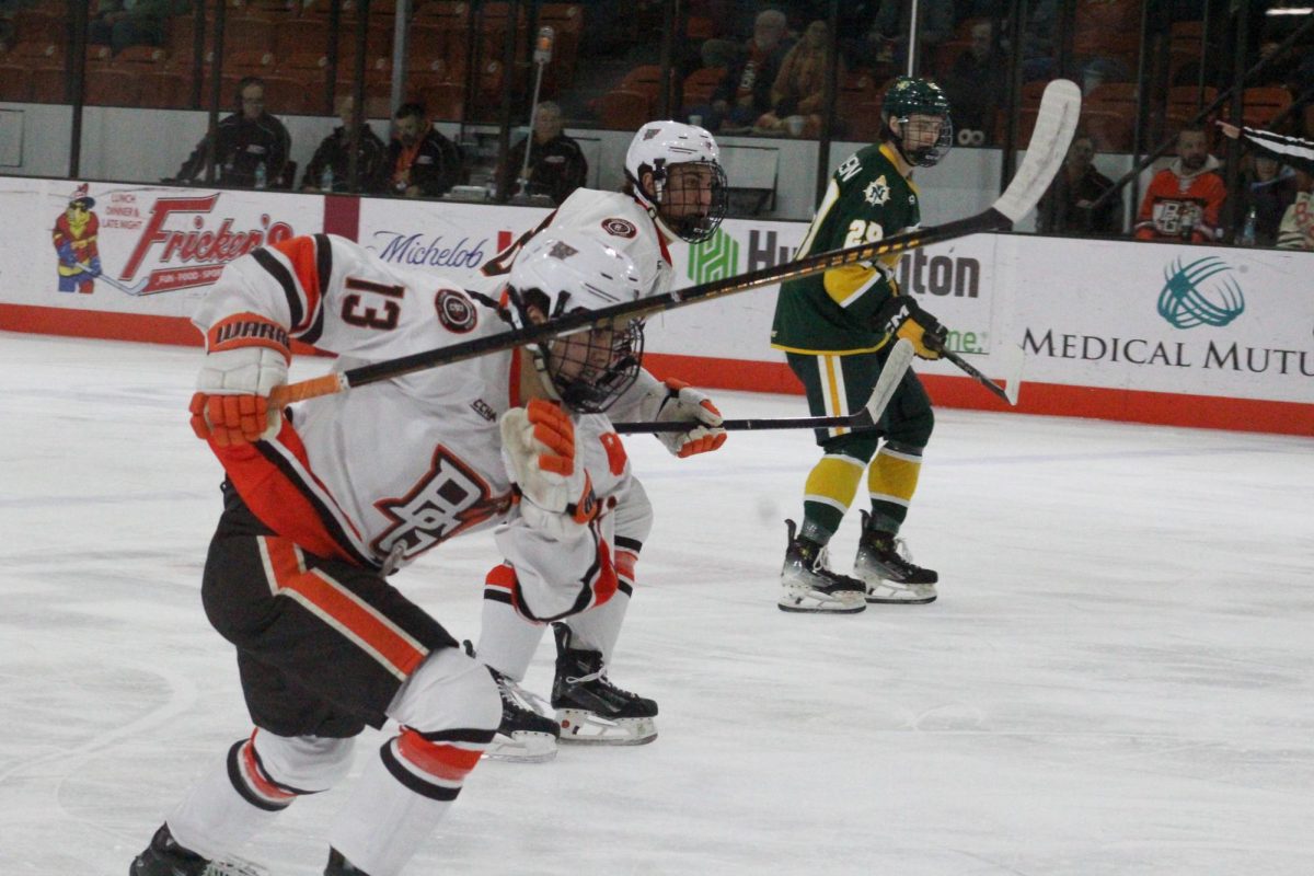 Bowling Green, OH - Falcons junior forward Brett Pfoh (13) playing against Northern Michigan at Slater Family Ice Arena in Bowling Green, Ohio